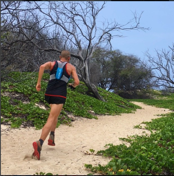 A man running outside wearing FS4 Plantar Fasciitis Compression socks.