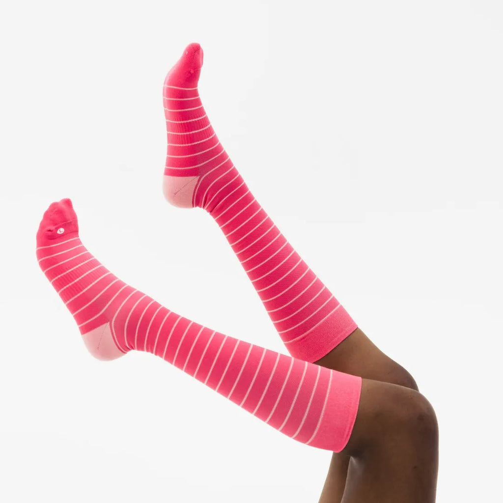 woman wearing pink with stripes wellness compression socks | OS1st