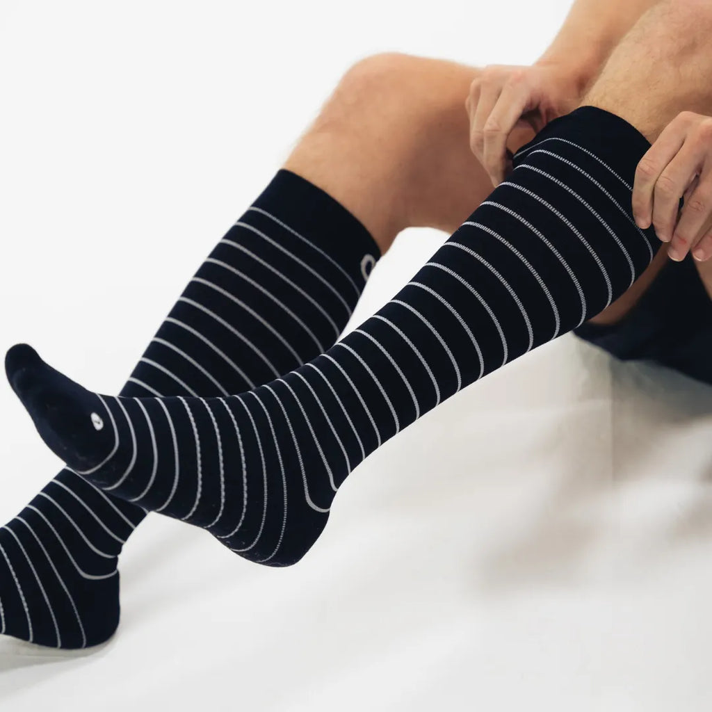 man wearing black with stripes wellness compression socks | OS1st