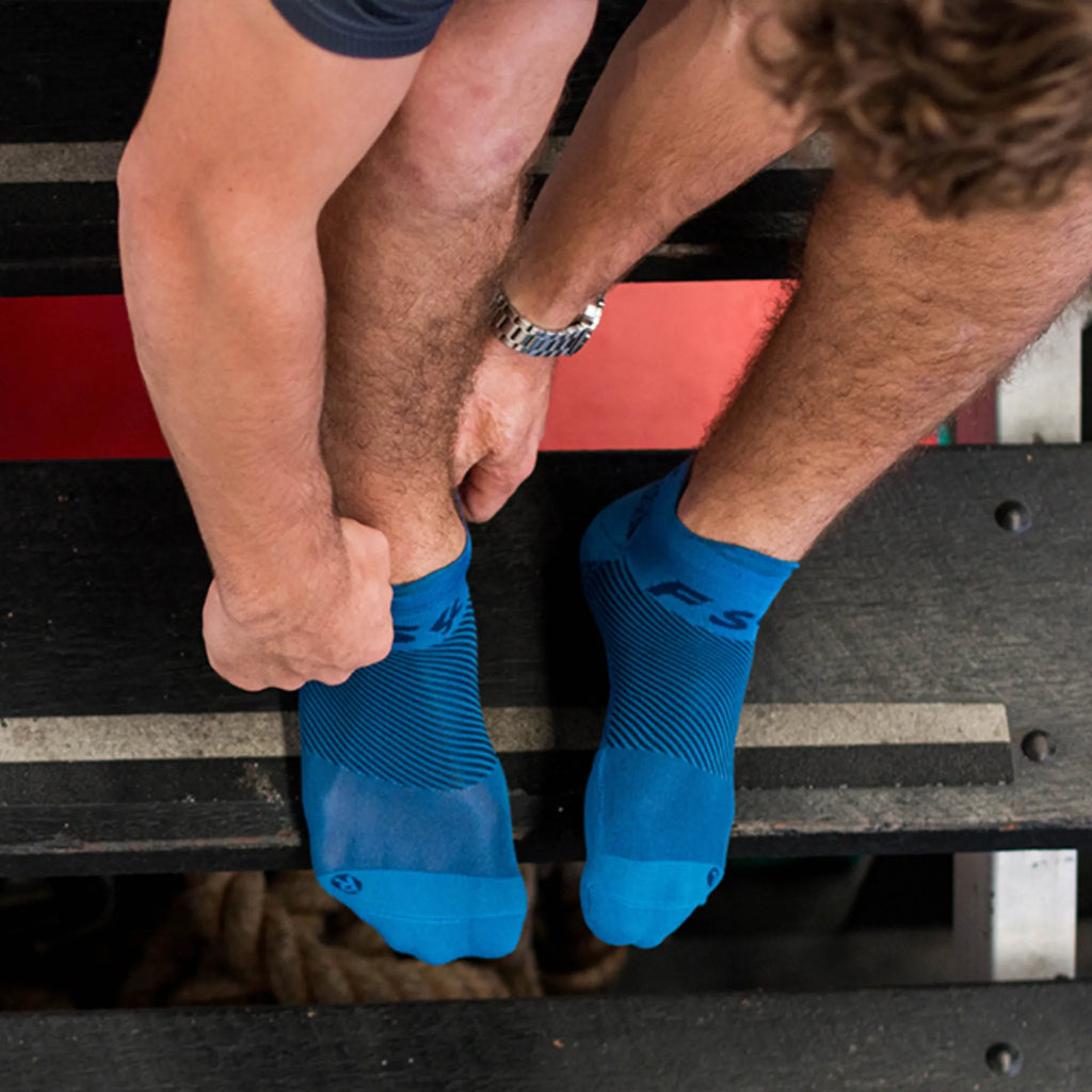 man wearing blue, no show plantar fasciitis socks | OS1st